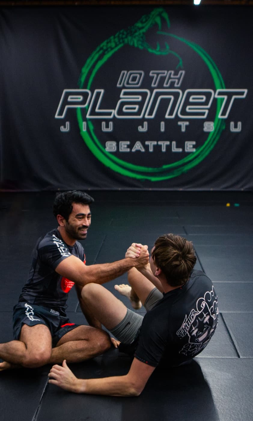 Adult Jiu-Jitsu at 10th Planet Seattle — live training on the mats.